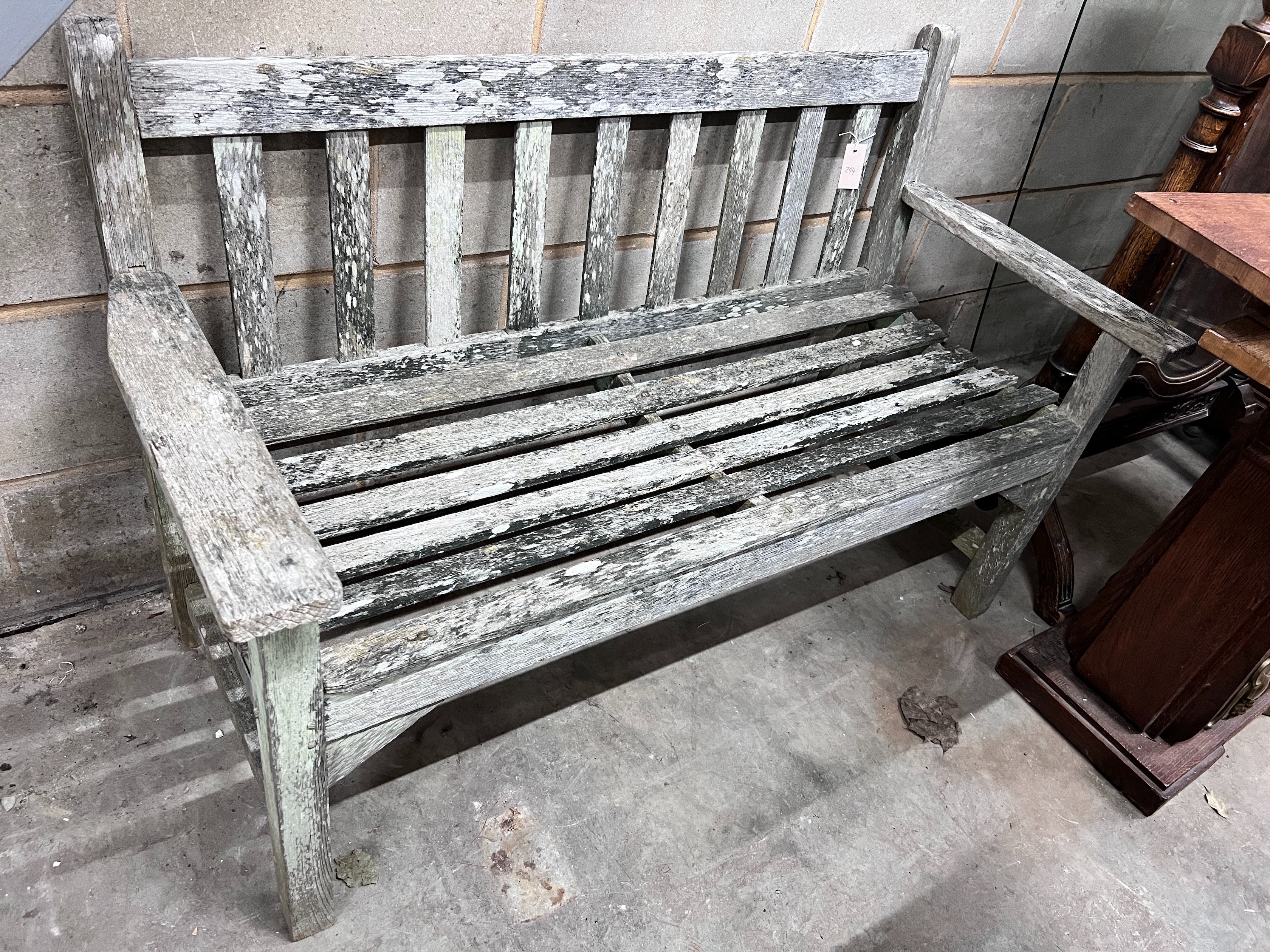 A Lister weathered teak garden bench, length 128cm *Please note the sale commences at 9am.